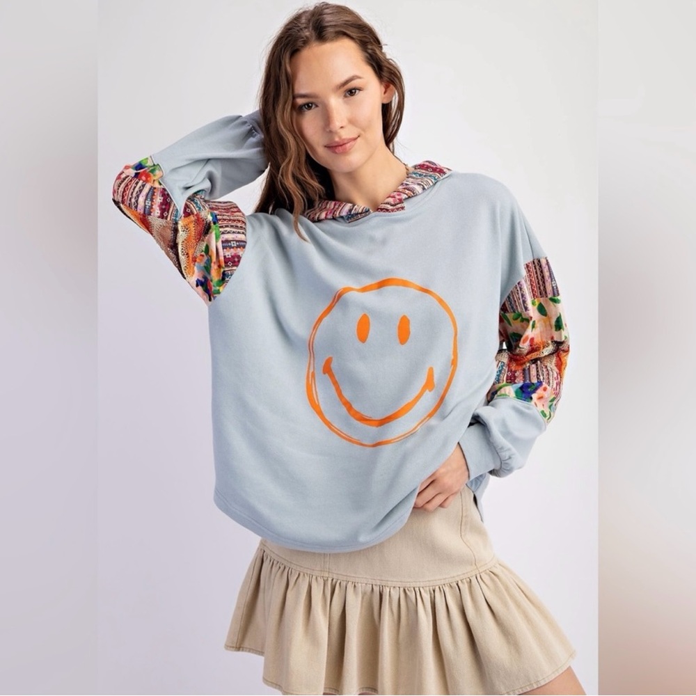 101 - Easel Light Blue Hoodie with Orange Smiley Face